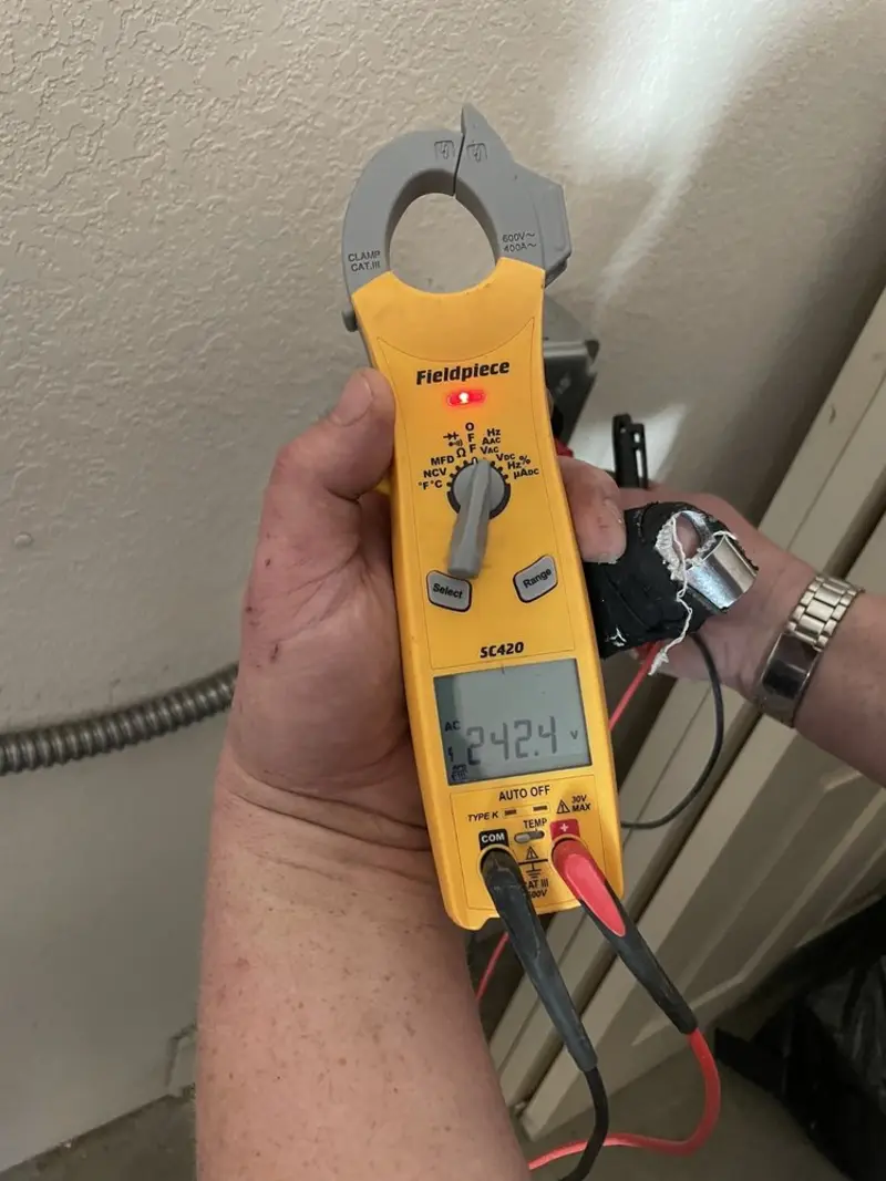 Voltage testing with clamp meter during Circuit Breaker Repair in Lake Delton